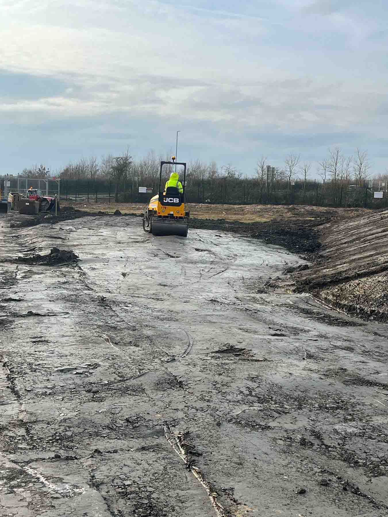 SMW Construction Services, groundworks contractor South Yorkshire, excavation services South Yorkshire, site preparation and clearance, concrete foundations UK, drainage installation for construction sites, kerbing and paving works, concrete flooring specialists, road and footpath preparation, civil engineering groundwork, construction site excavation team, slabbing and finishing works, trenching and drainage systems, site machinery in operation, groundwork specialists on site, commercial groundwork services, residential construction groundwork, heavy plant machinery excavation, SMW Construction Services team, professional site preparation, concrete pour and finishing work