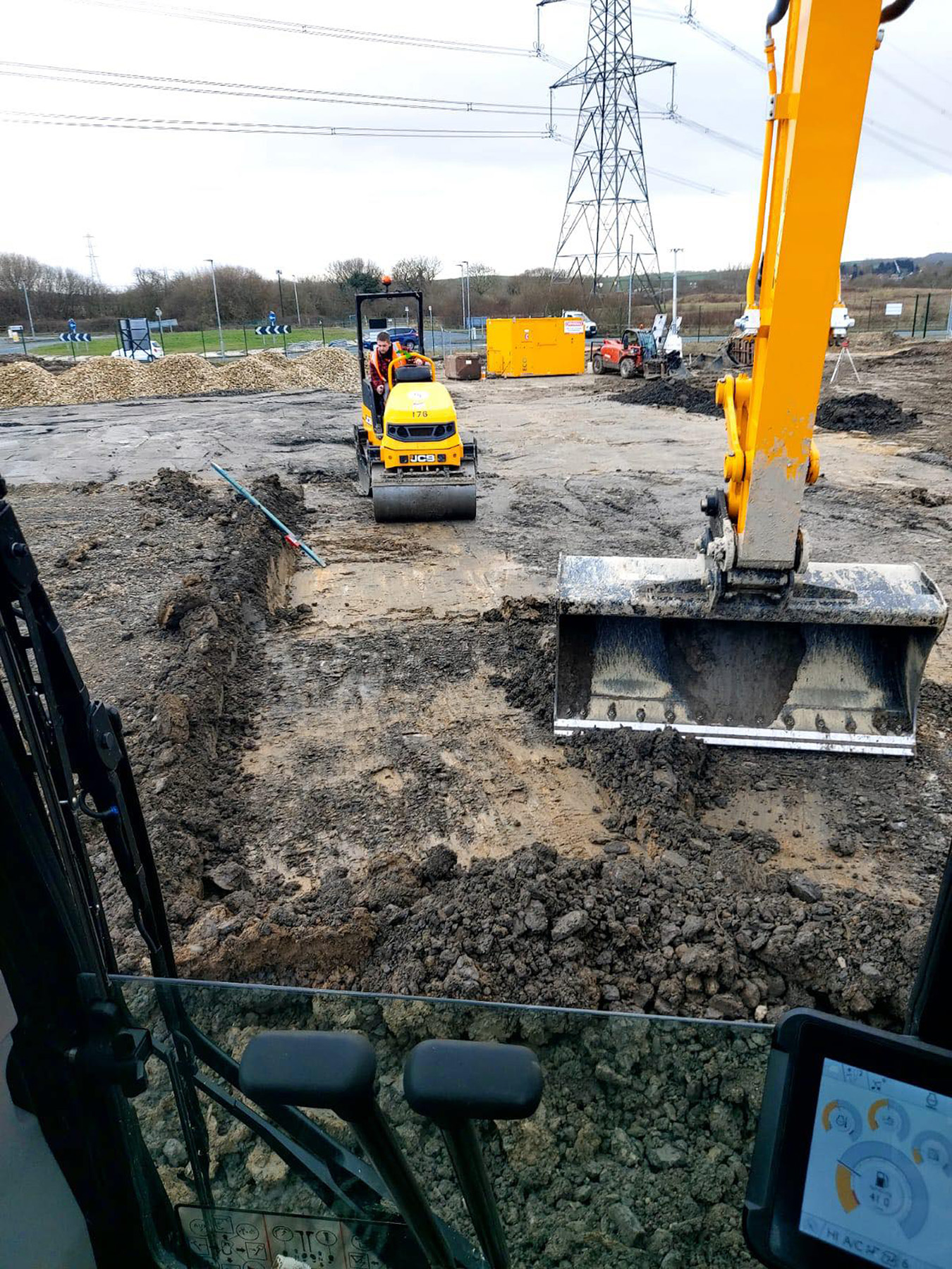 SMW Construction Services, groundworks contractor South Yorkshire, excavation services South Yorkshire, site preparation and clearance, concrete foundations UK, drainage installation for construction sites, kerbing and paving works, concrete flooring specialists, road and footpath preparation, civil engineering groundwork, construction site excavation team, slabbing and finishing works, trenching and drainage systems, site machinery in operation, groundwork specialists on site, commercial groundwork services, residential construction groundwork, heavy plant machinery excavation, SMW Construction Services team, professional site preparation, concrete pour and finishing work