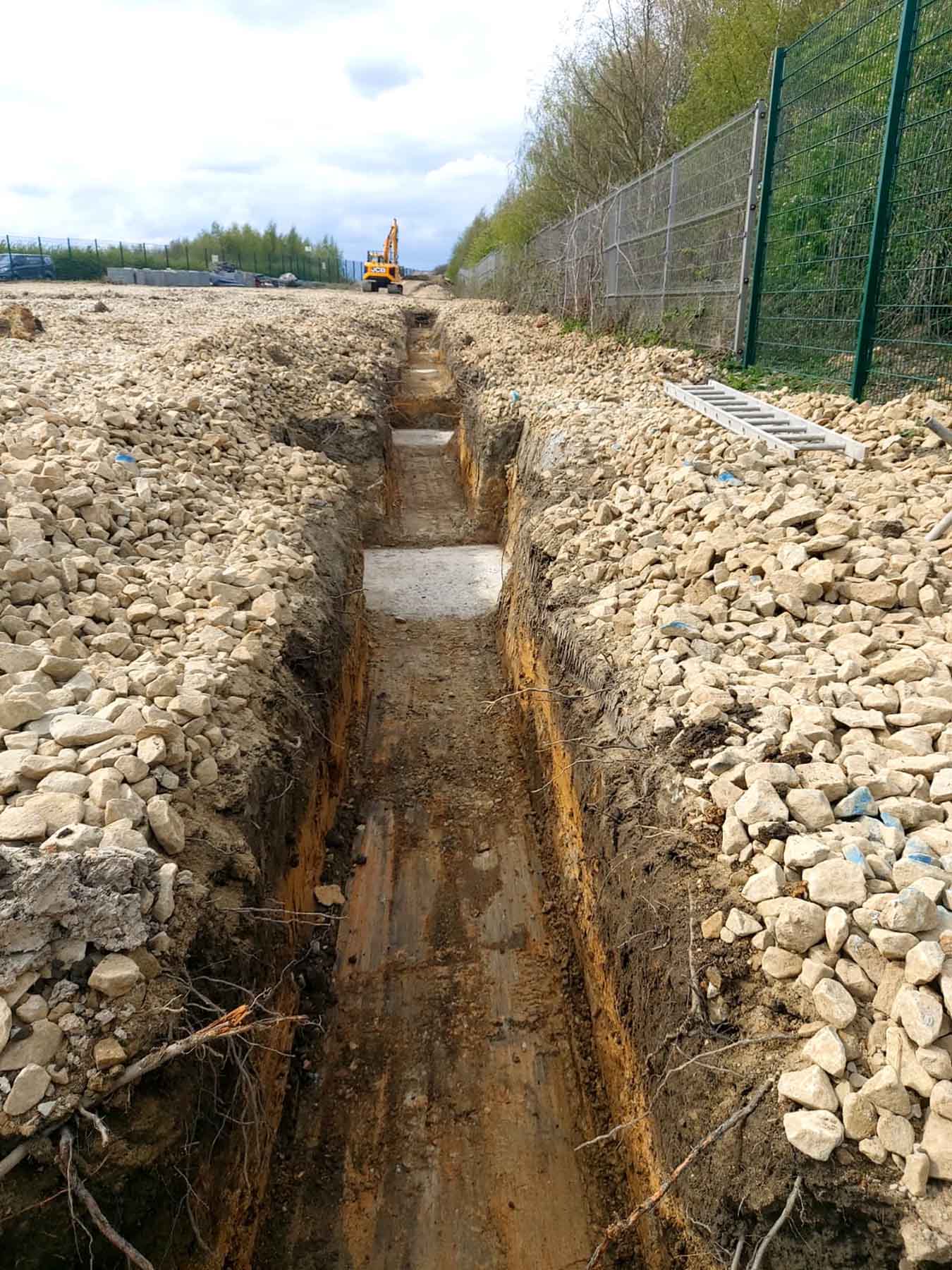 SMW Construction Services, groundworks contractor South Yorkshire, excavation services South Yorkshire, site preparation and clearance, concrete foundations UK, drainage installation for construction sites, kerbing and paving works, concrete flooring specialists, road and footpath preparation, civil engineering groundwork, construction site excavation team, slabbing and finishing works, trenching and drainage systems, site machinery in operation, groundwork specialists on site, commercial groundwork services, residential construction groundwork, heavy plant machinery excavation, SMW Construction Services team, professional site preparation, concrete pour and finishing work