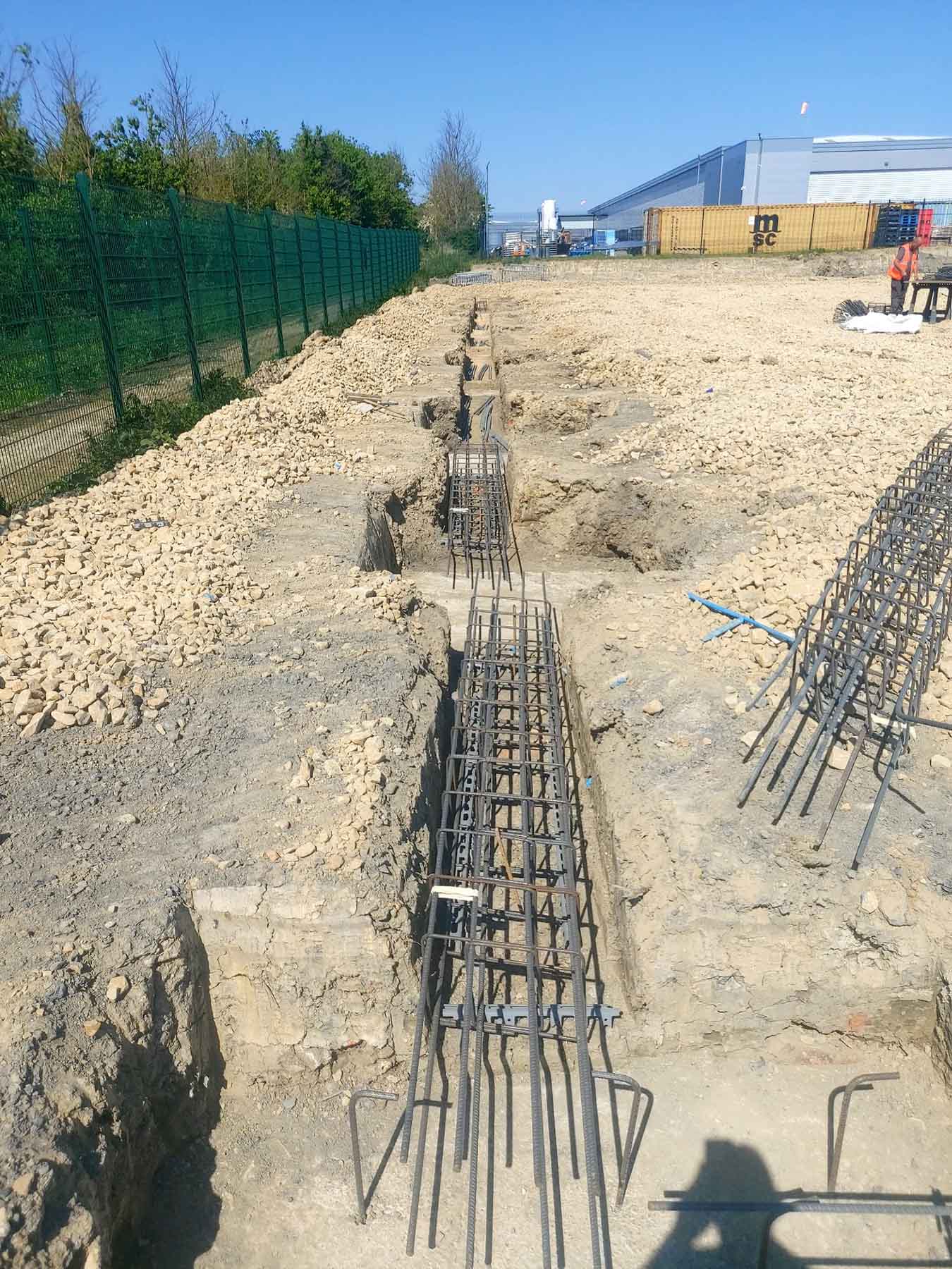 SMW Construction Services, groundworks contractor South Yorkshire, excavation services South Yorkshire, site preparation and clearance, concrete foundations UK, drainage installation for construction sites, kerbing and paving works, concrete flooring specialists, road and footpath preparation, civil engineering groundwork, construction site excavation team, slabbing and finishing works, trenching and drainage systems, site machinery in operation, groundwork specialists on site, commercial groundwork services, residential construction groundwork, heavy plant machinery excavation, SMW Construction Services team, professional site preparation, concrete pour and finishing work
